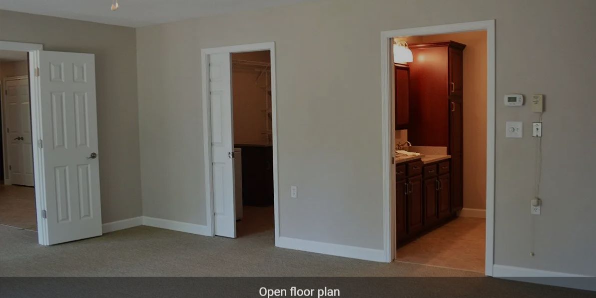 Interior view showcasing an open floor plan with visible doorways.