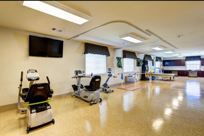 A well-equipped indoor fitness and rehabilitation center with exercise machines.