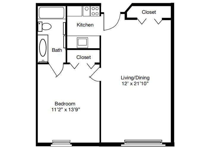 A floor plan of a one-bedroom apartment with a living/dining area, kitchen, bathroom, and closets.