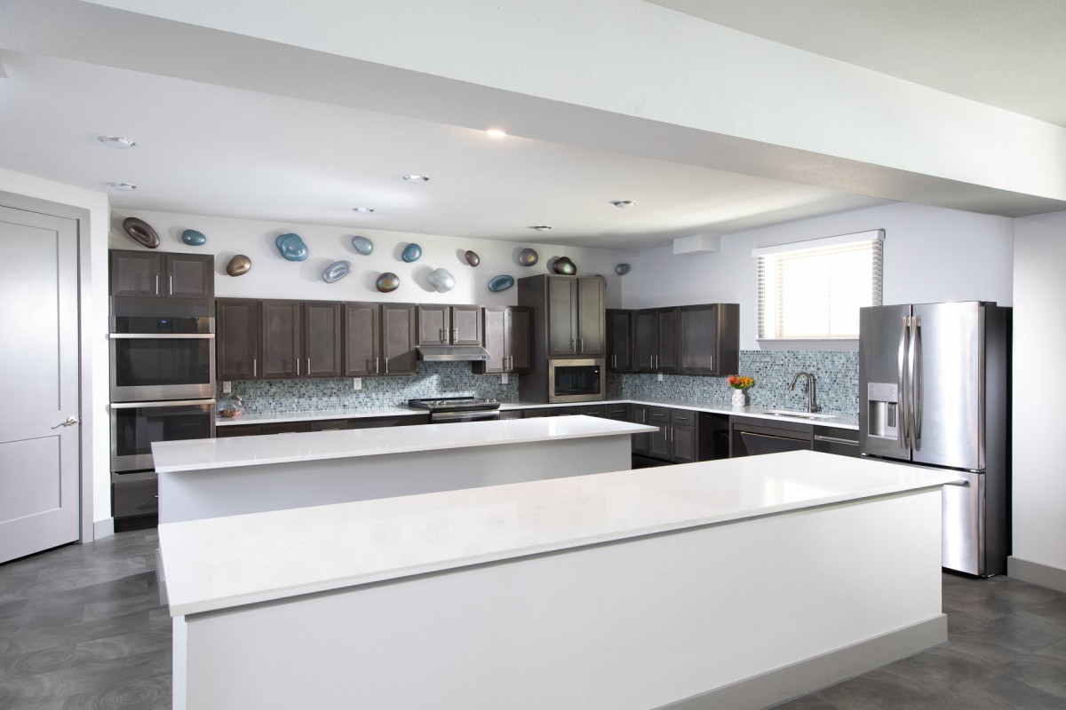 A modern kitchen with sleek countertops and contemporary decor.