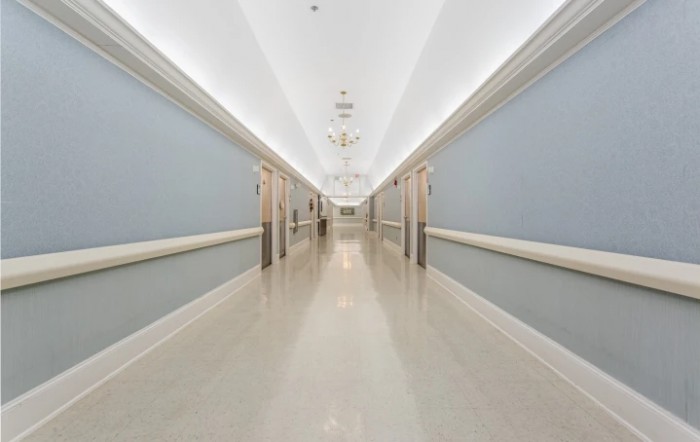 A modern, well-lit corridor with symmetrical design.