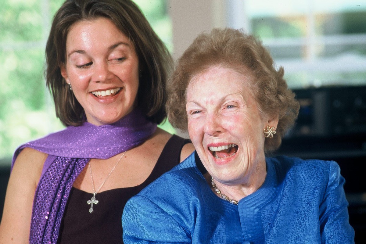 Two women sharing a joyful moment together.