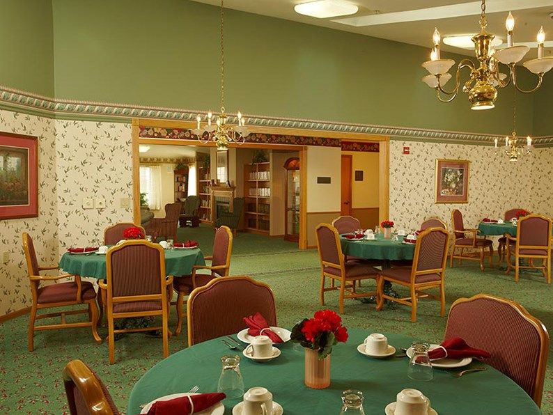 A well-decorated dining room with tables set for a meal.