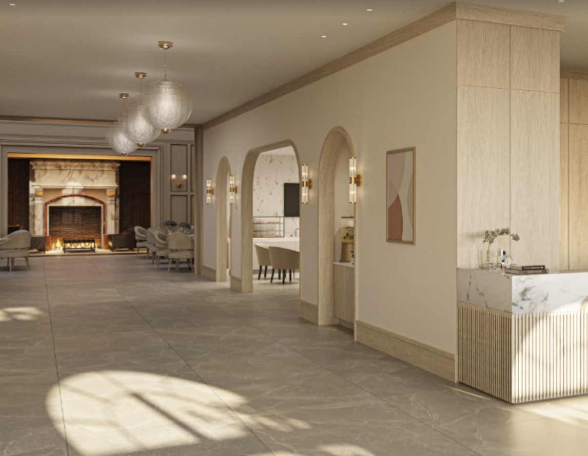 A modern and elegantly designed hallway with soft lighting and minimalist furnishings.