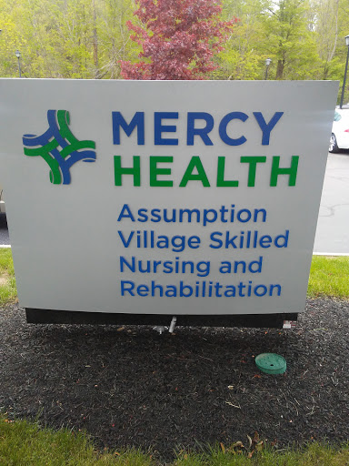 Sign for Mercy Health's Assumption Village, dedicated to skilled nursing and rehabilitation services.