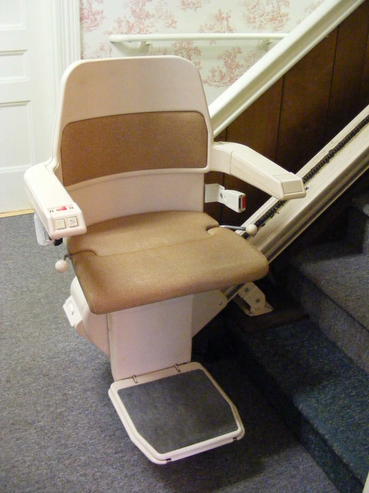 A stairlift installed on a staircase for accessibility.