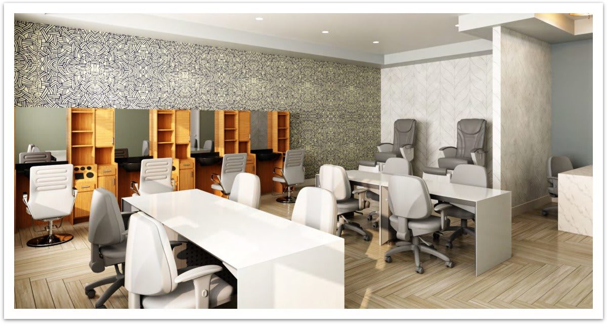 A modern office interior with multiple workstations and ergonomic chairs.