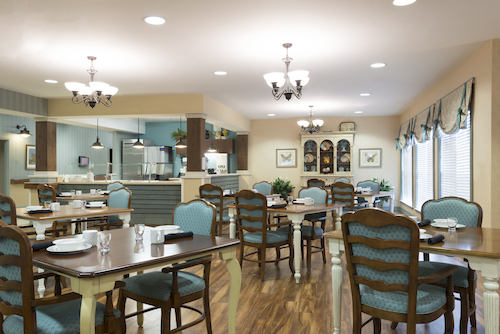 A cozy dining area featuring elegant furniture and a warm atmosphere.