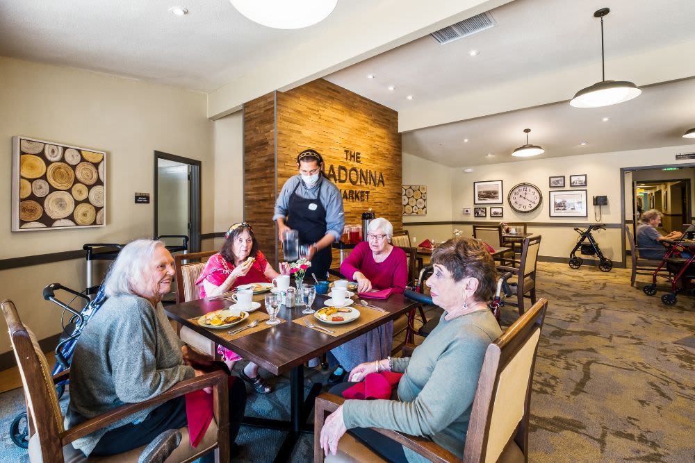 Seniors enjoying a meal together in a cozy restaurant setting.
