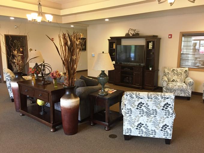 Cozy living room with elegant furniture and decorative elements.