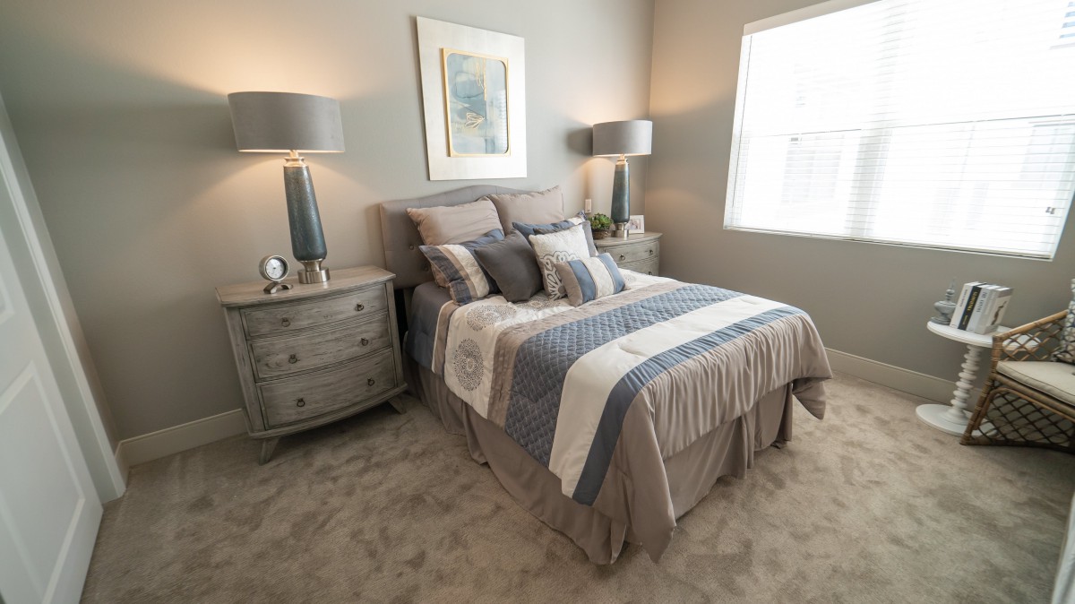 A modern and cozy bedroom with elegant furnishings and soft lighting.