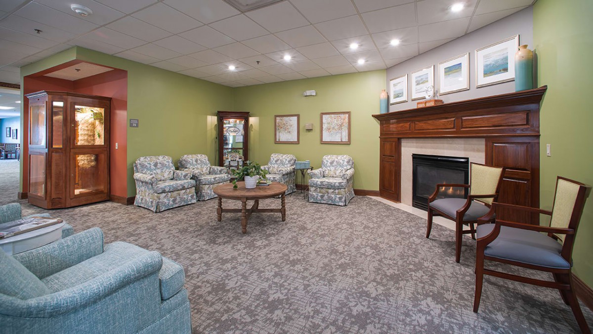 A cozy living room with comfortable seating and a fireplace.