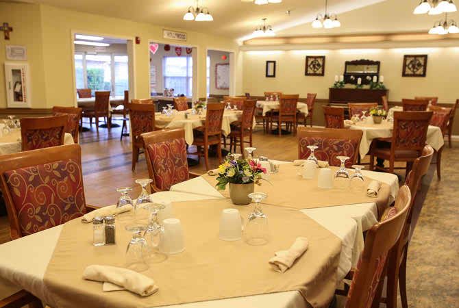 A cozy and elegantly set dining area in a restaurant, featuring neatly arranged tables and chairs.
