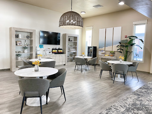 A stylish and modern lounge area featuring light-colored furniture and a welcoming atmosphere.