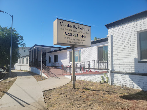 A healthcare facility with a clear sign displaying contact information.