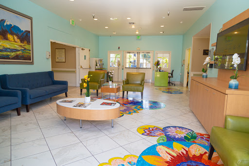 A vibrant and inviting lobby featuring modern furniture and colorful decorations.