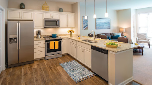 A stylish modern kitchen featuring sleek appliances and a warm, inviting atmosphere.