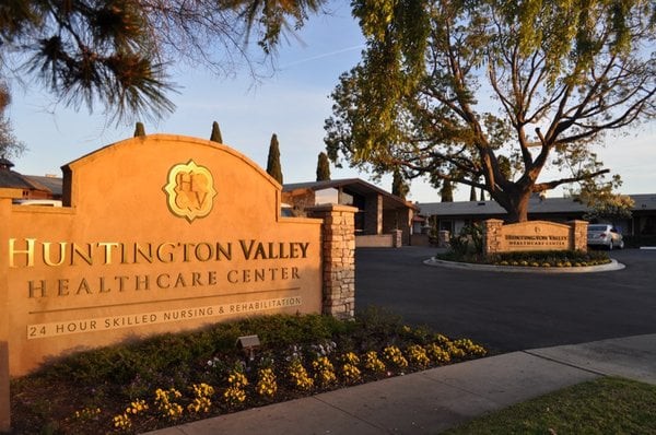 A healthcare center with a prominent entrance sign and well-maintained landscaping.