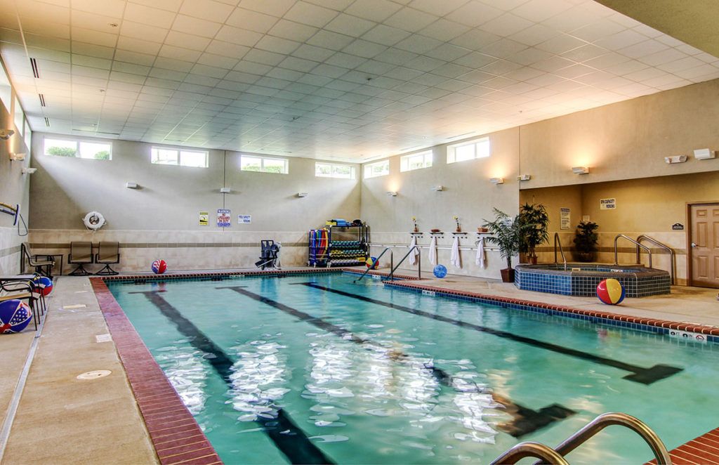 An indoor swimming pool with designated lanes for exercise.