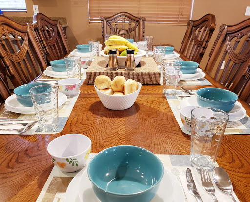 A beautifully arranged dining table ready for a family meal.