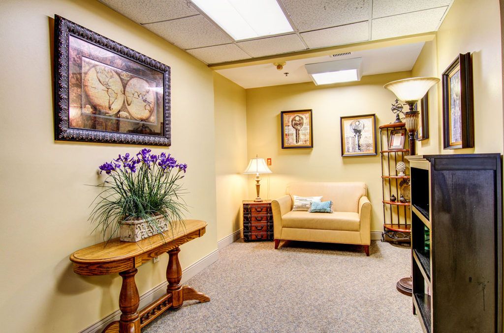 A cozy waiting room with comfortable seating and elegant decor.