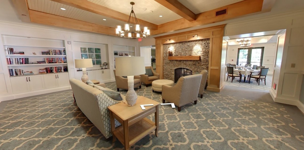 A cozy and modern living room with comfortable seating and a fireplace.