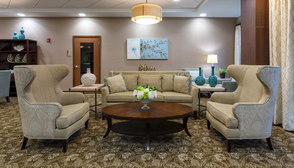 A well-decorated living room with comfortable seating and stylish decor.