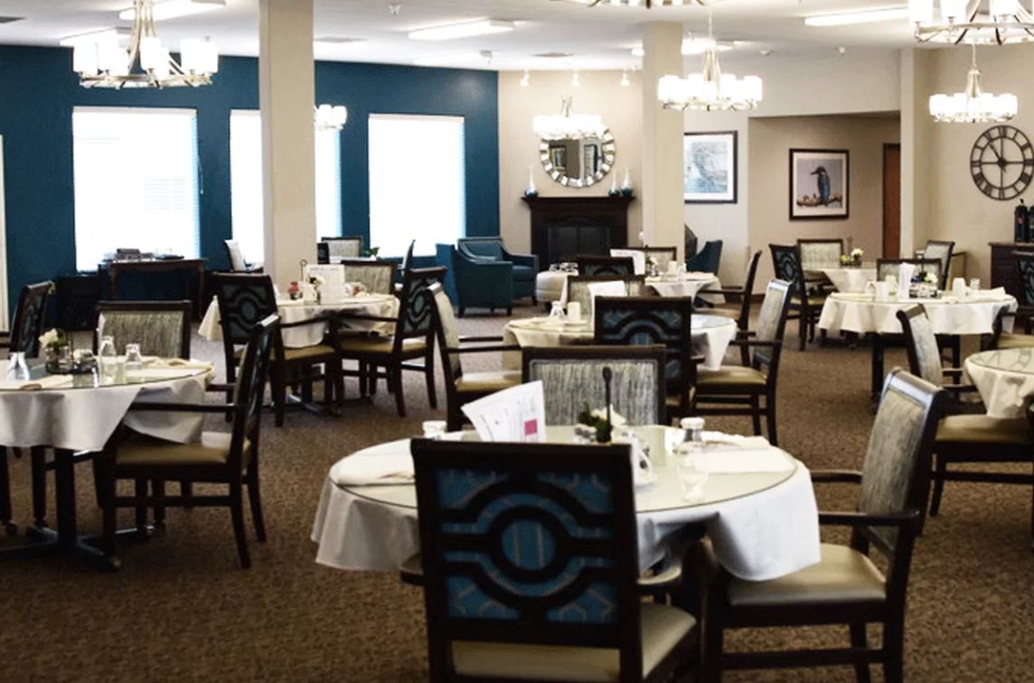 A well-appointed dining room with elegantly set tables and stylish decor.