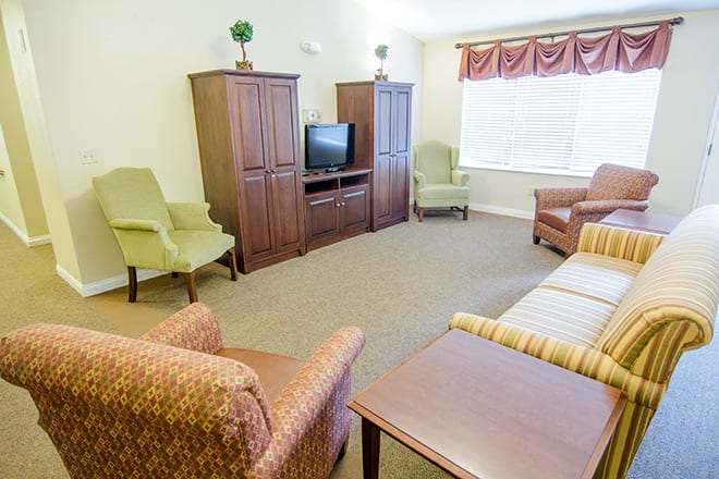 A cozy living room with comfortable seating and a television.