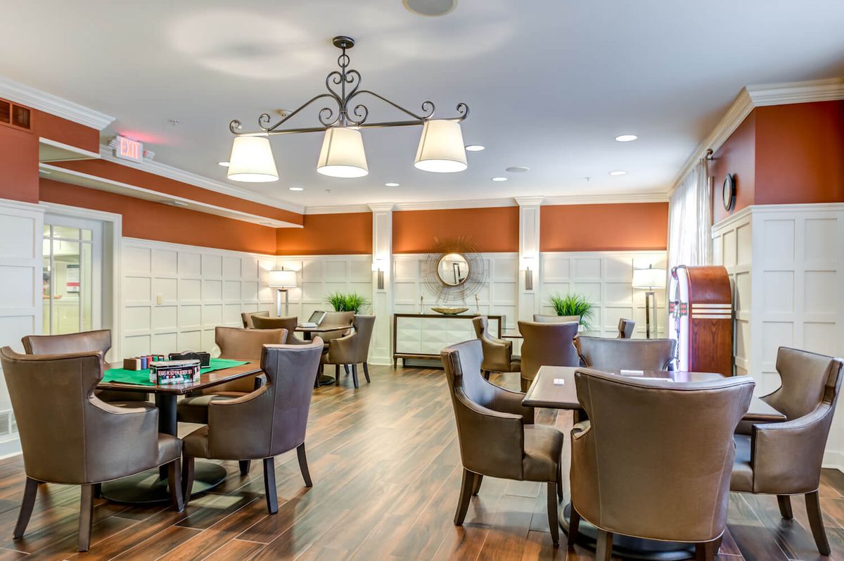 A well-lit dining area with elegant furniture and modern decor.