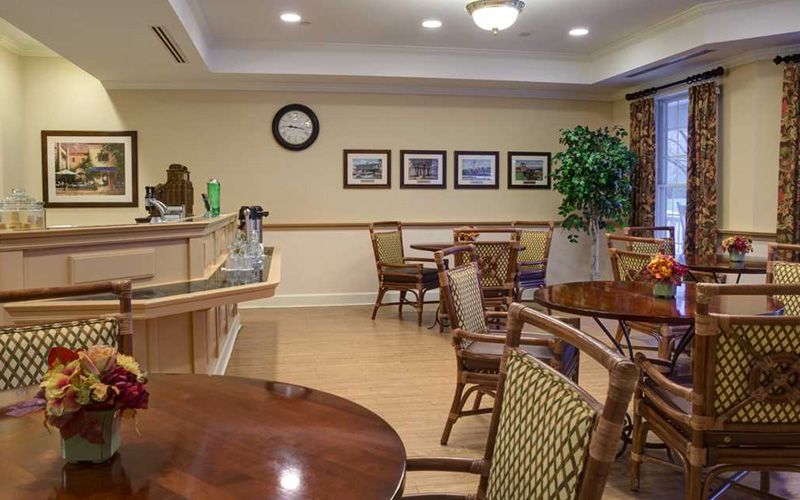 Cozy cafe interior with seating area and decorative elements.