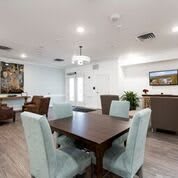 A modern and spacious open-concept living and dining area with elegant furnishings.