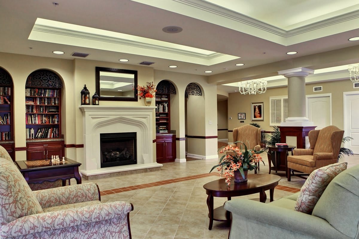 Elegant living room with a fireplace and comfortable seating.