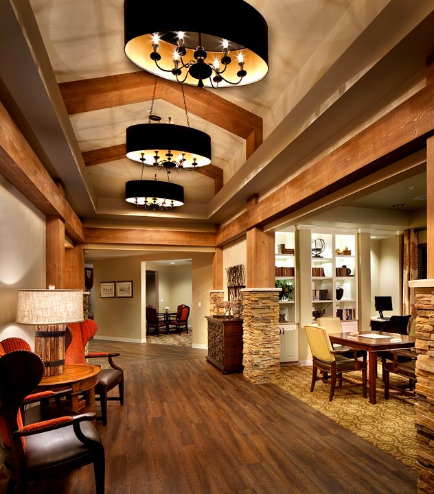 A stylish lobby area featuring modern lighting and wooden accents.