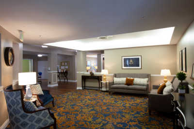 A spacious lobby with comfortable seating and warm lighting.