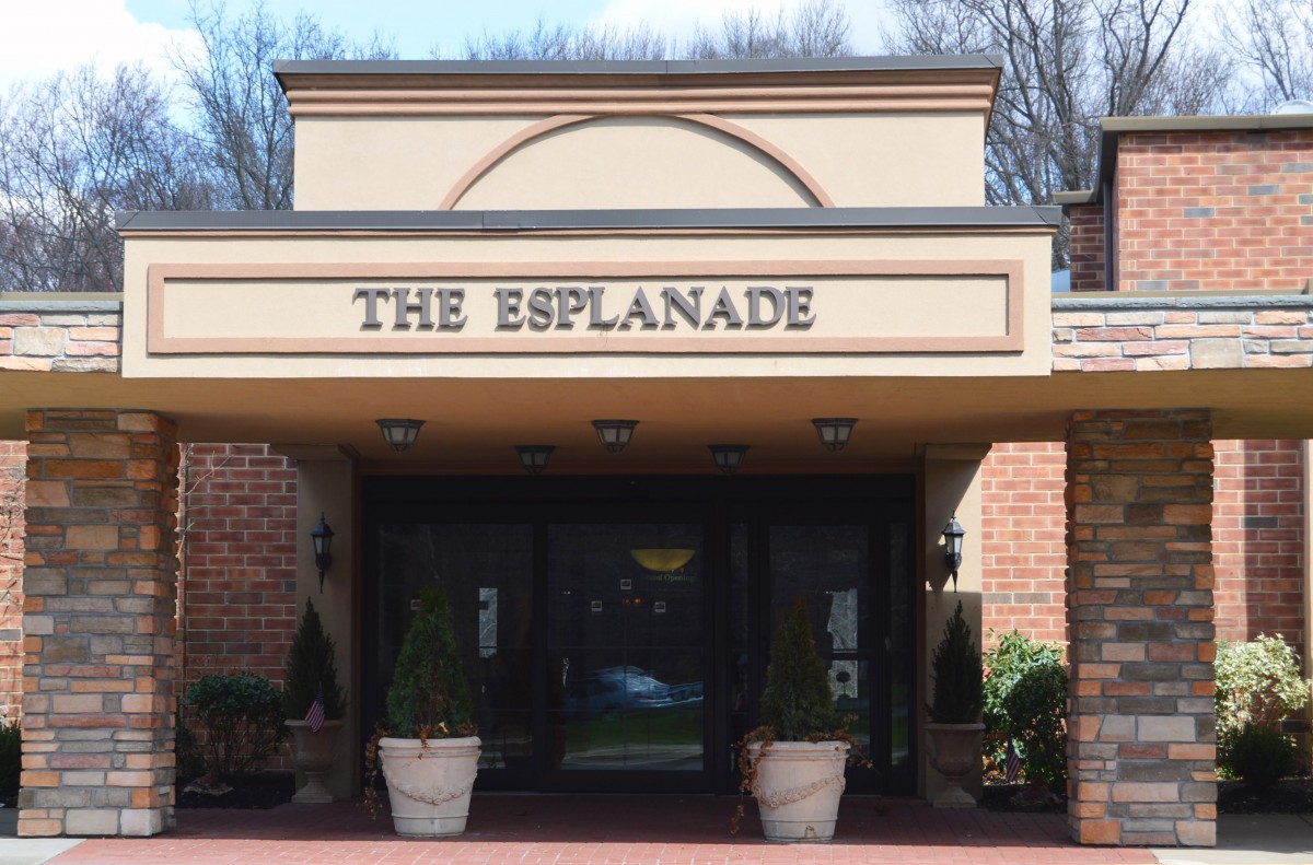Entrance to The Esplanade building with a prominent sign.