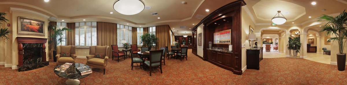 A cozy lounge area with seating and warm lighting.