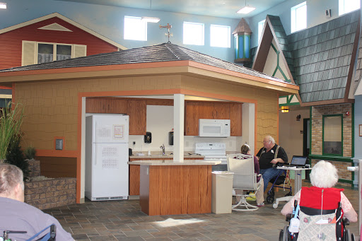 A model kitchen setup showcasing various appliances in a home construction environment.