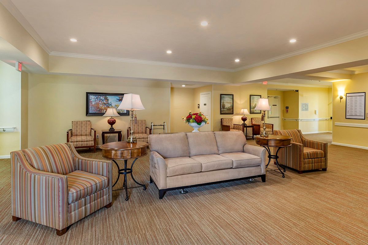 A cozy living room with comfortable seating and elegant decor.