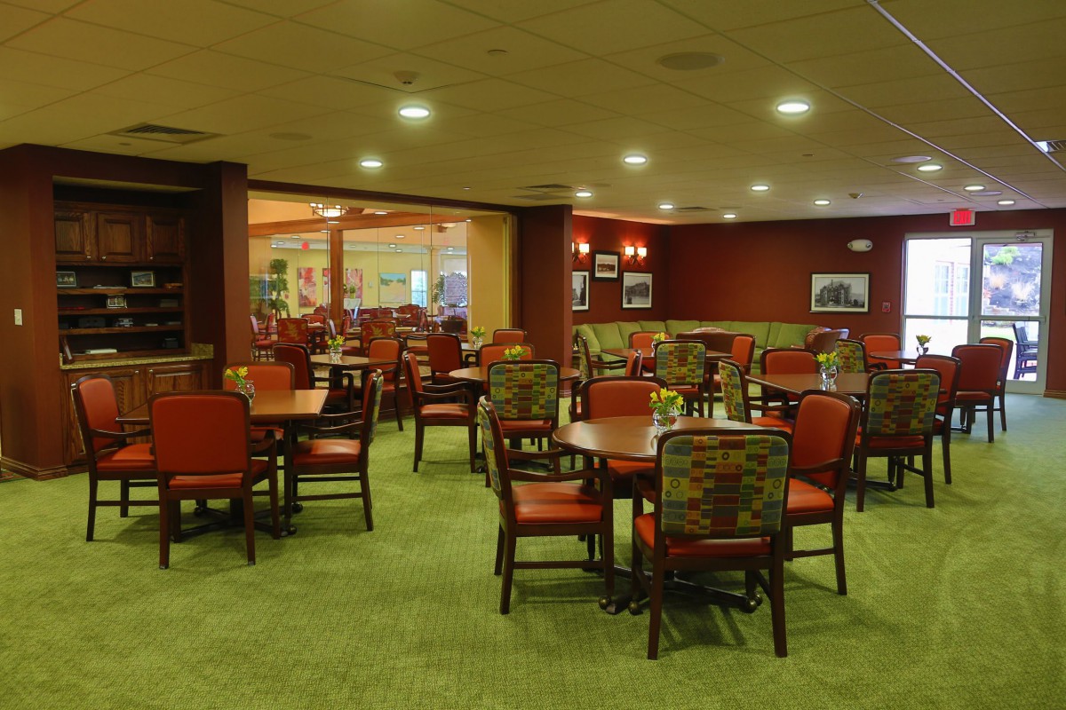 A cozy restaurant dining area with neatly arranged tables and chairs.