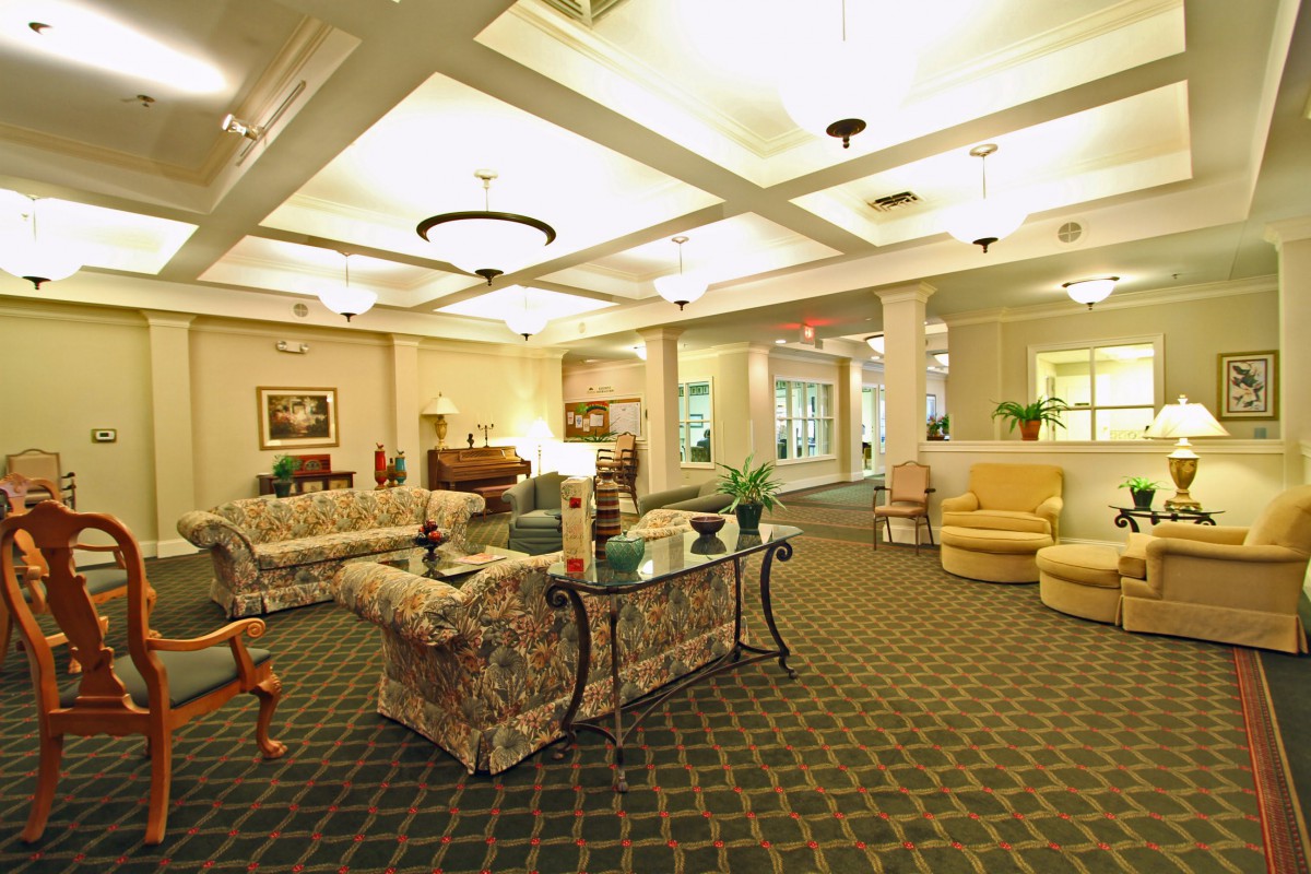 A spacious and elegant lobby area with comfortable seating and warm lighting.
