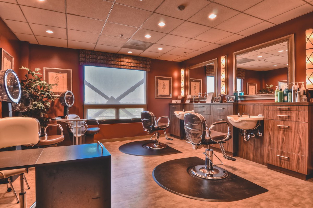 A stylish and well-equipped hair salon with multiple styling stations.