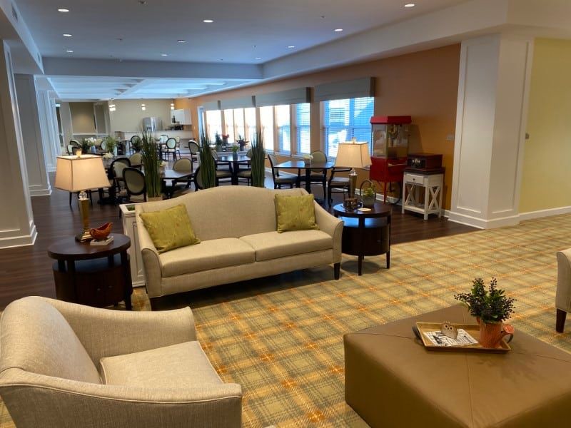 A cozy lounge area with comfortable seating and warm lighting.