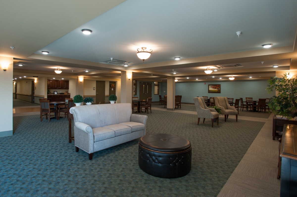 A spacious lobby with comfortable seating and elegant lighting fixtures.