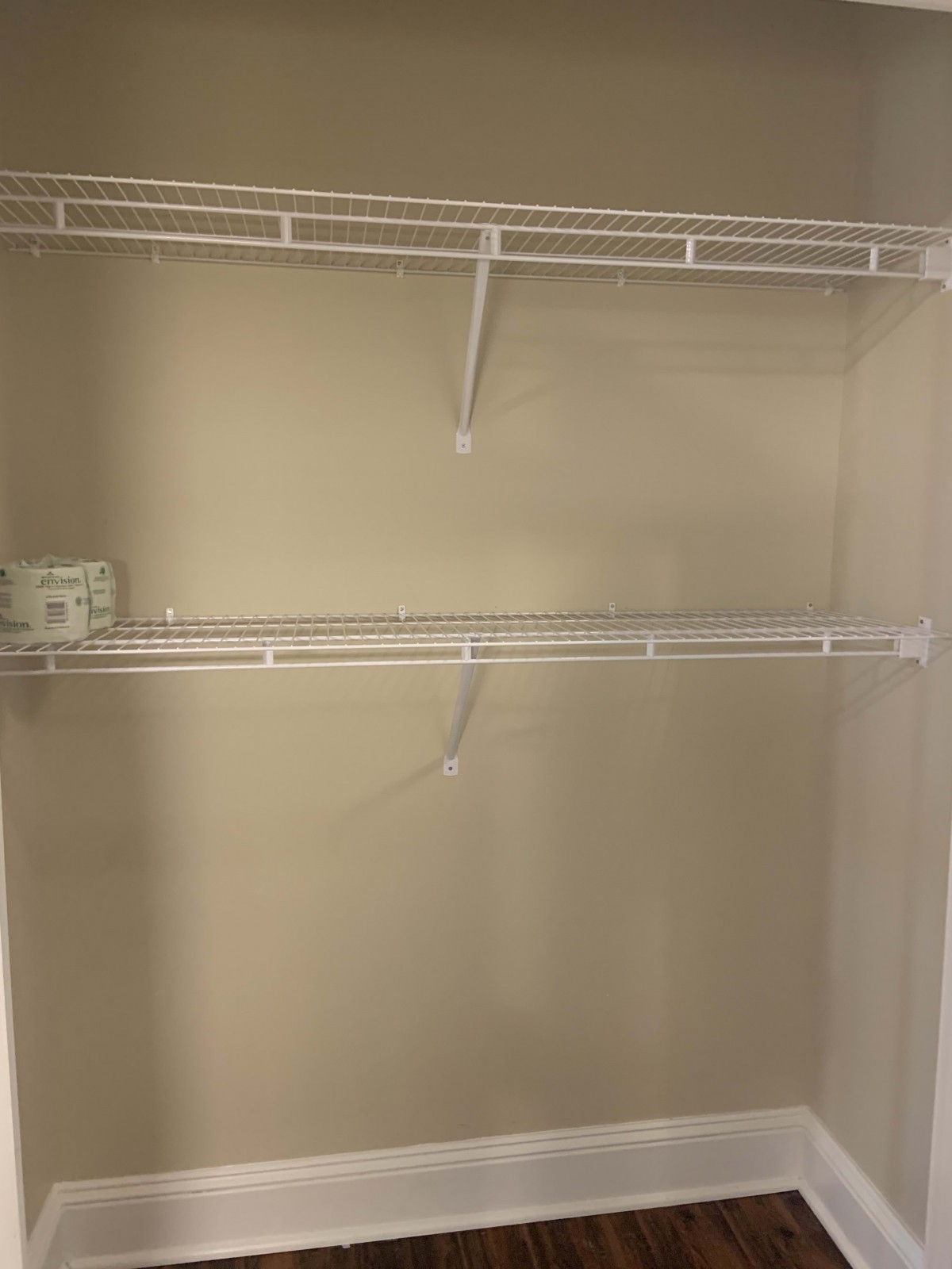 An empty closet with wire shelving ready for storage.