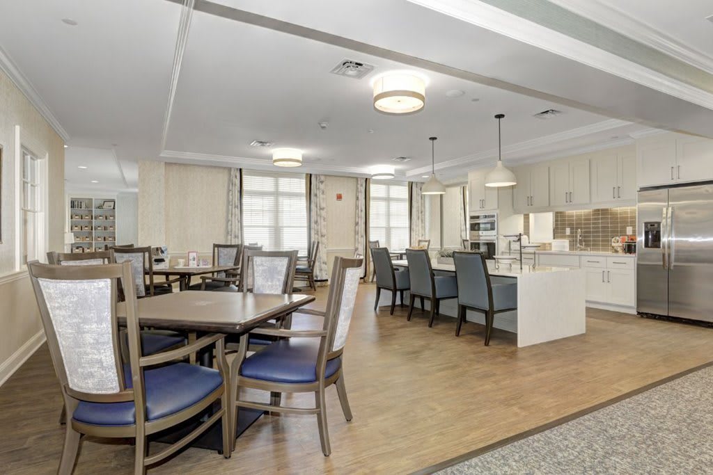 A modern dining area featuring elegant tables and chairs with contemporary lighting.