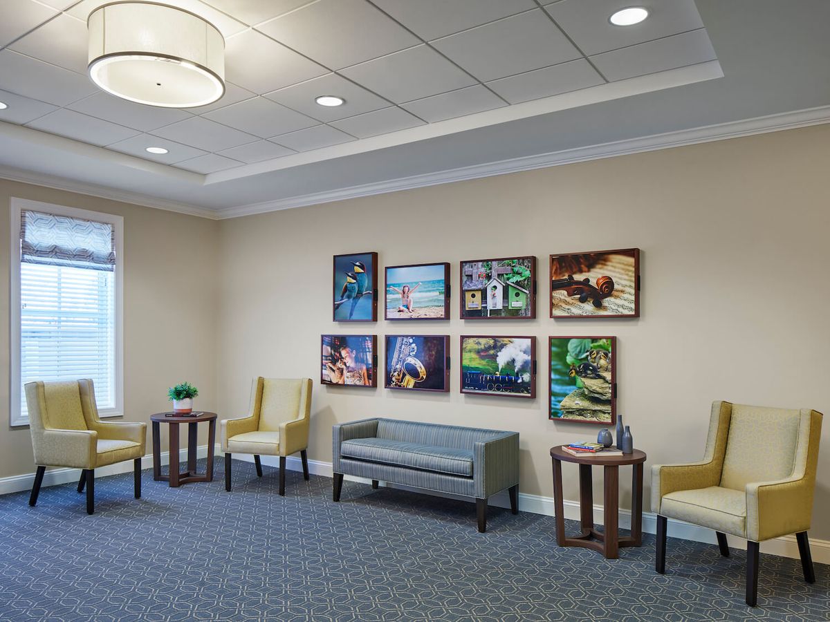 A well-designed waiting room featuring comfortable seating and vibrant artwork.