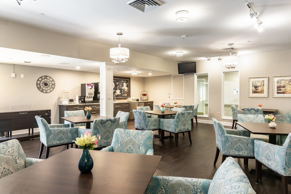 A modern dining area with comfortable seating and elegant decor.