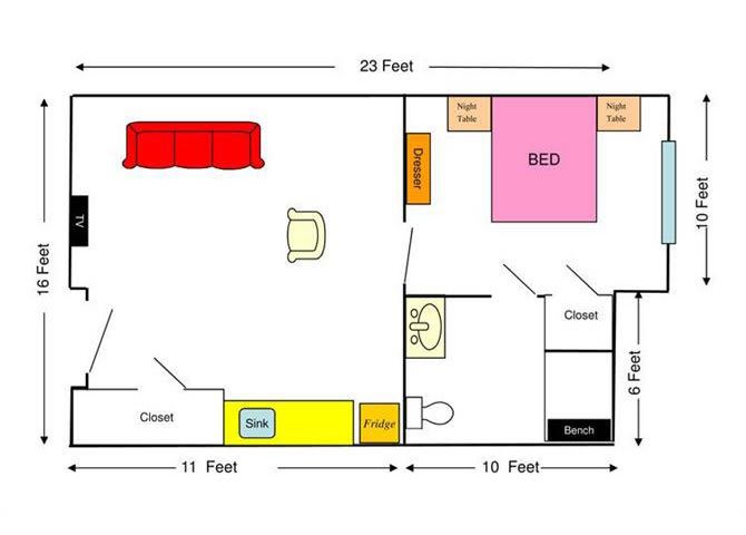 This is a floor plan of an apartment showing the layout and dimensions of various rooms, including the living area, kitchen, bedroom, and bathroom with furniture placement.