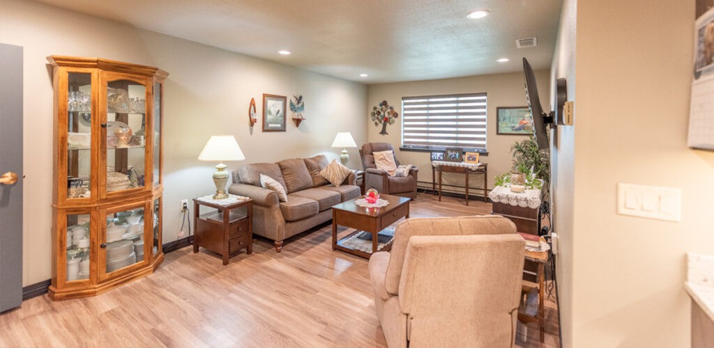 A cozy living room with comfortable seating, bright lamps, and stylish decor.
